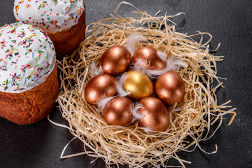 Easter golden eggs in the nest, preparation for the holiday