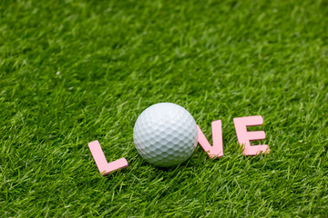 Golf with love sign on green grass