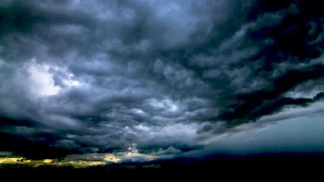 Timelapse  black clouds  move and gathered,condense into a rain cloud a heavy rain