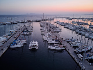 Aerial drone bird's eye view of marina in Athens with docked yachts.