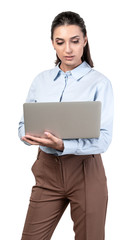Serious young woman using laptop, isolated