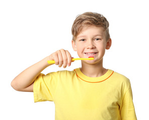 Cute little boy with toothbrush on white background