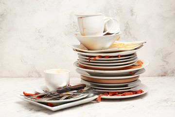 Dirty tableware on light background