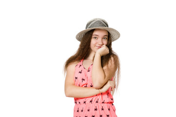 Beautiful smiling joyful cute teenager in a summer hat posing on a white background
