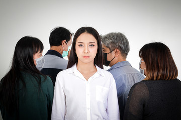 Fototapeta premium Asian women are scared of the people around them wearing antiviral masks. Covid-19 or coronavirus. The concept of disease prevention and treatment of patients.