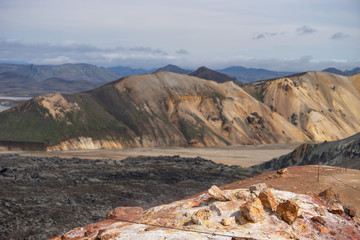 Landmannalaugar Valley. Iceland. Colorful mountains on the Laugavegur hiking trail. The combination of layers of multi-colored rocks, minerals, grass and moss