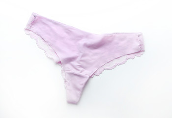 Pink satin panties with lace on white background.Women's underpants on white background.Basic pink lingerie,top view.