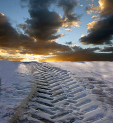 winter tire tracks in the snow