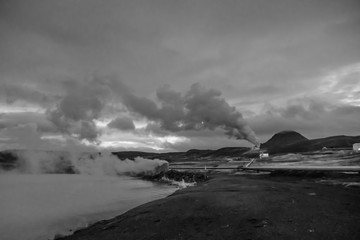 Blue Lake in Iceland geothermal hot lake turquoise water steam pipelines in black and white