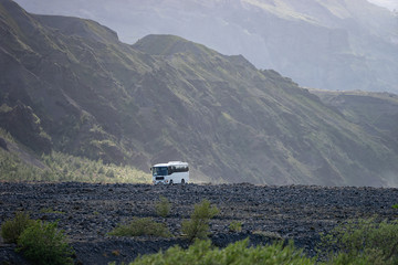 Iceland mountain view with 4x4 big bus. Waiting for tourists © Hladchenko Viktor
