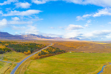 Naklejka premium Northern Iceland during autumn aerial photo of trees and landscape turning yellow during nice weather