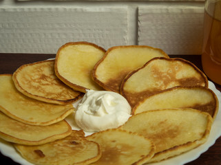 Homemade fritters with sour cream