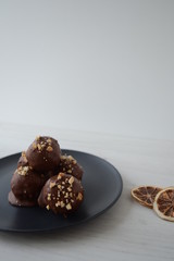 Raw food candies with coconut, chocolate, lemon zest and nuts. Useful sweets.