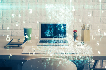 Double exposure of desktop computer and technology theme hologram. Concept of software development.