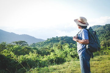 Senior woman backpacking hiking Nature travel He is healthy. The concept of a happy life after retirement . Copy space