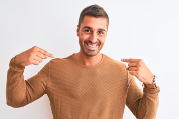 Young handsome elegant man wearing winter sweater over isolated background looking confident with...