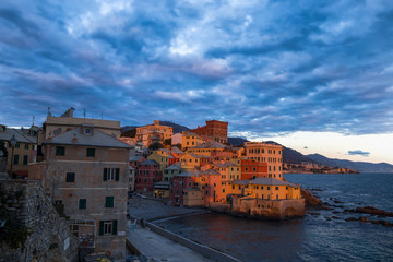 Fototapeta na wymiar GENOA, ITALY, FEBRUARY 7, 2020 - View of Genova Boccadasse under a cloudy sky at sunset, Italy.