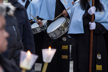 Holy Week procession with candles and orchestra down the street