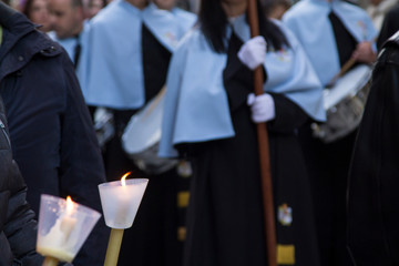 Holy Week procession with candles and orchestra down the street