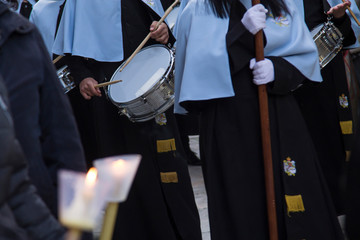 Holy Week procession with candles and orchestra down the street