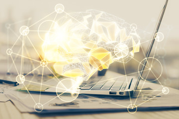 Multi exposure of work table with computer and brain hologram. Brainstorm concept.