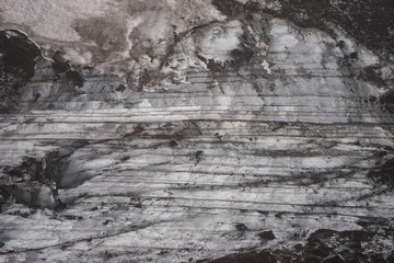 Ice and ashes of the volcano texture landscape, beautiful nature ice background from Iceland.
