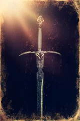 Fotobehang Magyc sword on moss background, old photo effect. © jozefklopacka