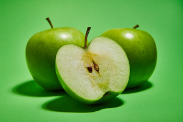 Apple on green background. Flat lay, top view, copy space . Food dietary concept.