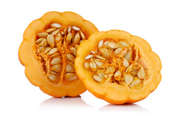 Half mini pumpkin with seeds isolated