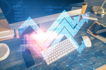 Computer on desktop with point up arrows hologram. Double exposure. Concept of success.