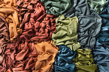 Pattern of colored fabrics. View from above.
