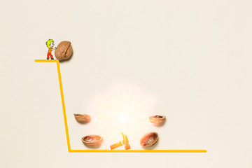 The boy throws a walnut from the top of the mountain on a heavy hammer lying at the foot of the mountain in order to split it.