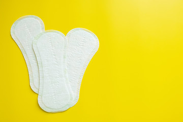 daily sanitary pad on a bright yellow background close-up of copy space