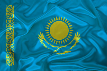 beautiful photo of a colored national flag of the modern state of Kazakhstan on a textured fabric, concept of tourism, emigration, economy and politics, closeup