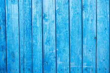 Fototapeta na wymiar Old painted blue wall textured background, vertical boards
