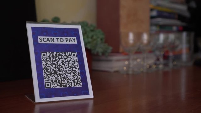 Display with QR code in the store. QR code payment is a contactless payment method by scanning a QR code from a mobile app