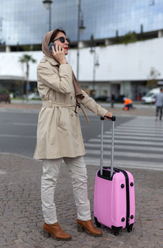 Arab woman with hijab talking on the phone