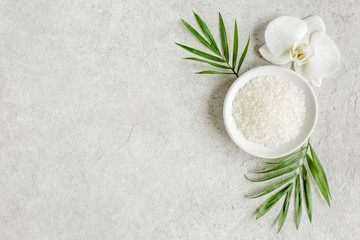 Spa skincare concept. Natural/Organic spa cosmetics products, sea salt on gray marble table from...
