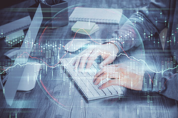 Double exposure of financial graph with man works in office on background. Concept of analysis.