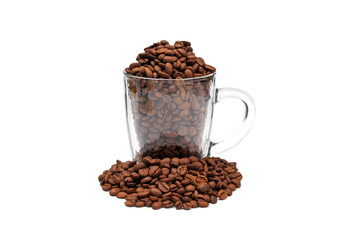 glass mug overfilled with roasted coffee beans isolated on white background