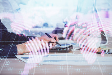 Double exposure of businessman working on laptop on background. International business hologram in front. Concept of success.
