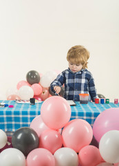 The child draws a picture. Balloon children party.