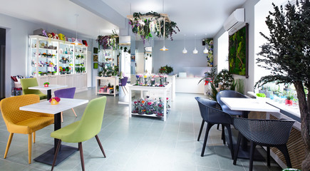 Eco cafe with live plants hanging from the lamp
