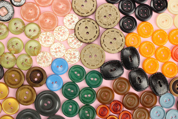 Different colored buttons for sewing background, texture