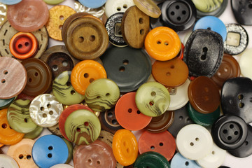 Different colored buttons for sewing background, texture