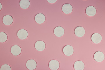 Hygiene cotton pads on pink background, texture, background