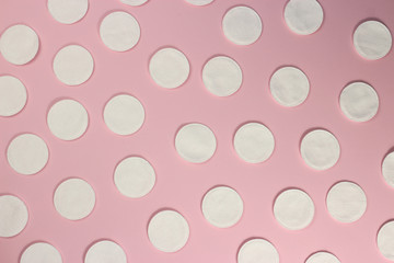 Hygiene cotton pads on pink background, texture, background