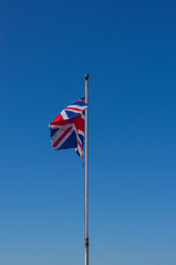 The United Kingdom flag on background of blue sky