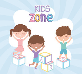 Obraz premium kids zone, cute little girl and boys playing with alphabet blocks toys