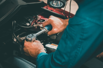 Mechanics checking and repairing the car. Car auto services concepts